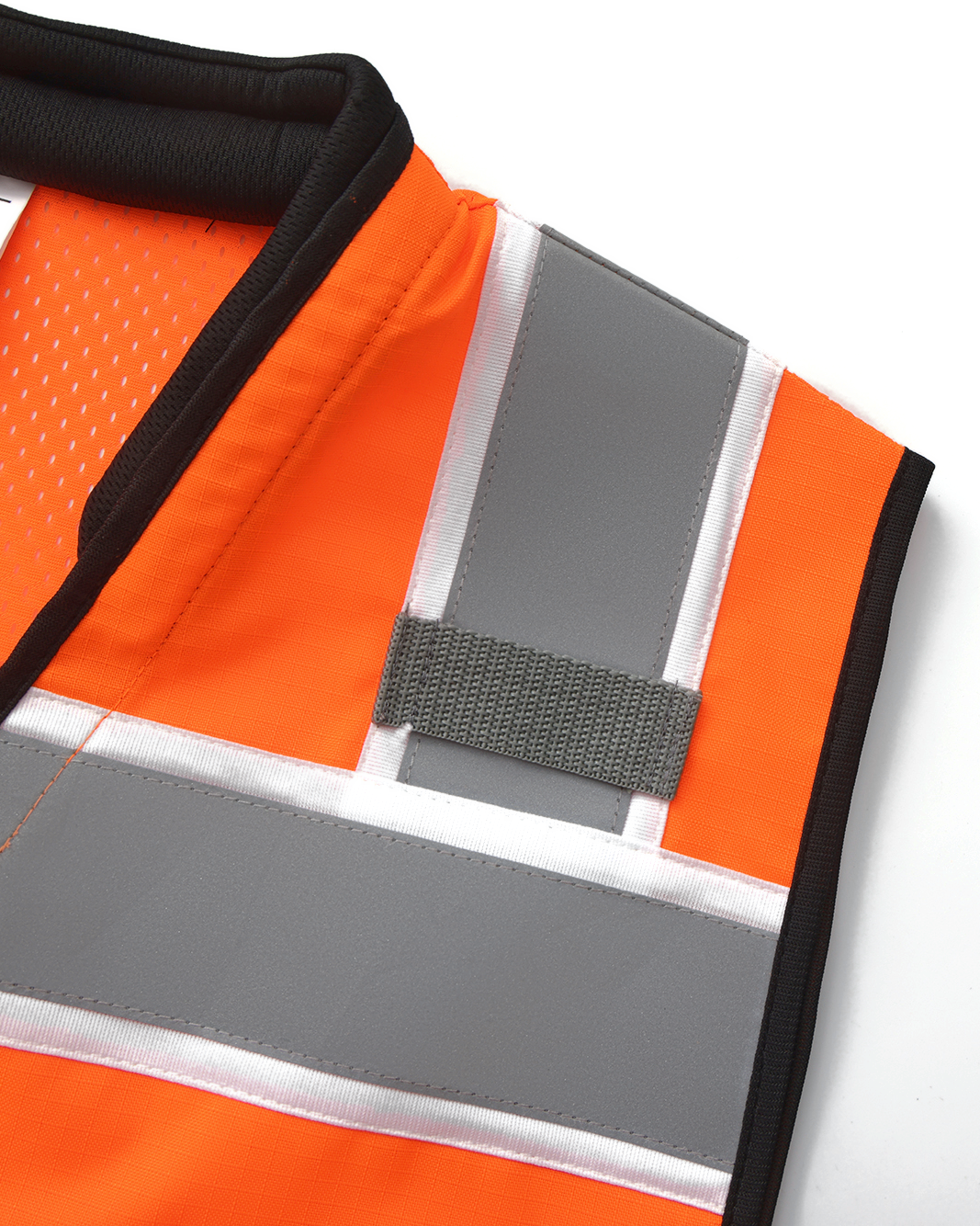 Shoulder mic tab on the reflective stripe of the Kiwi Sightline 704 vest